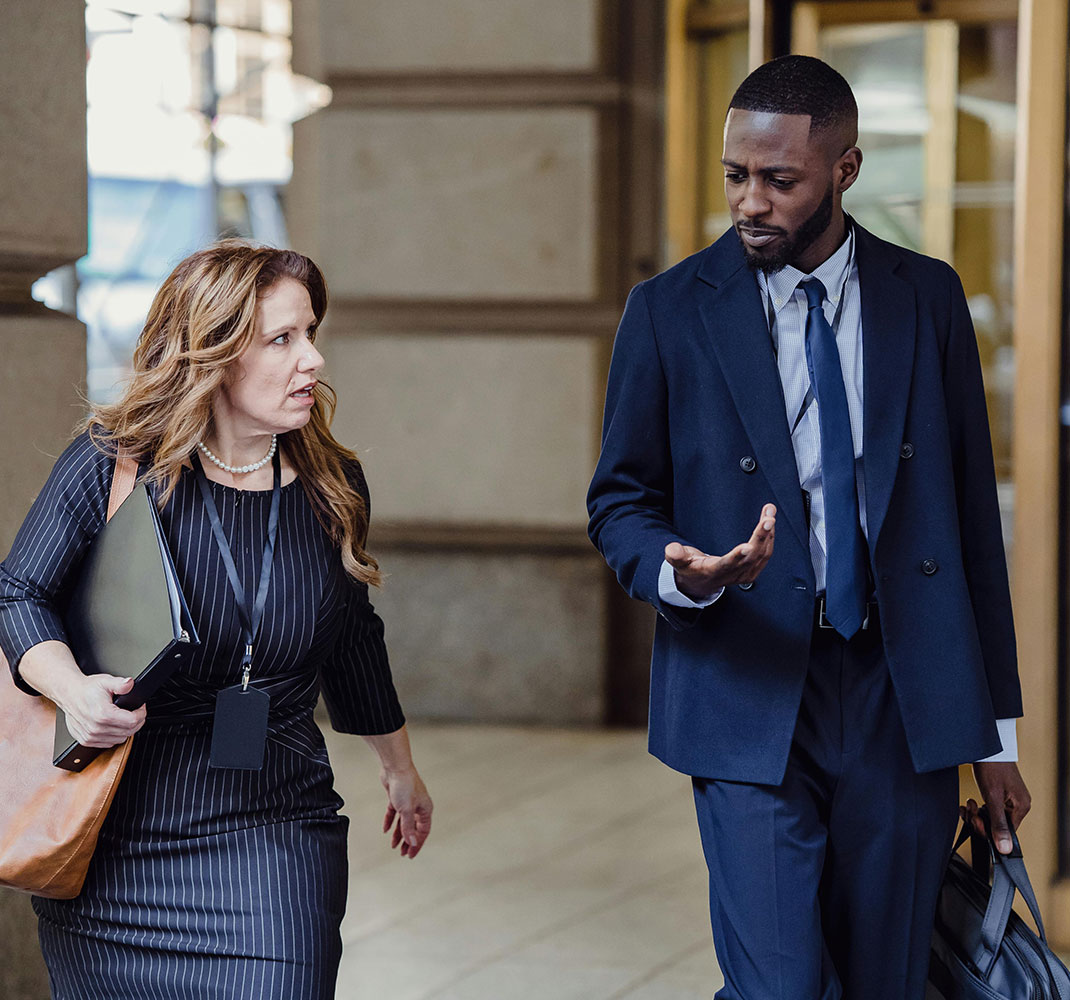 Business professionals walking outside of an office