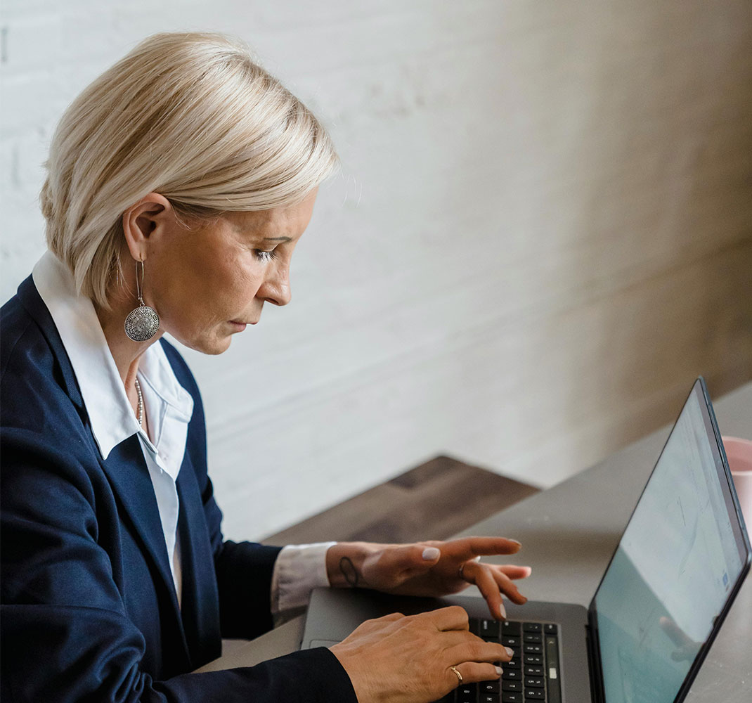 Professional woman working at laptop