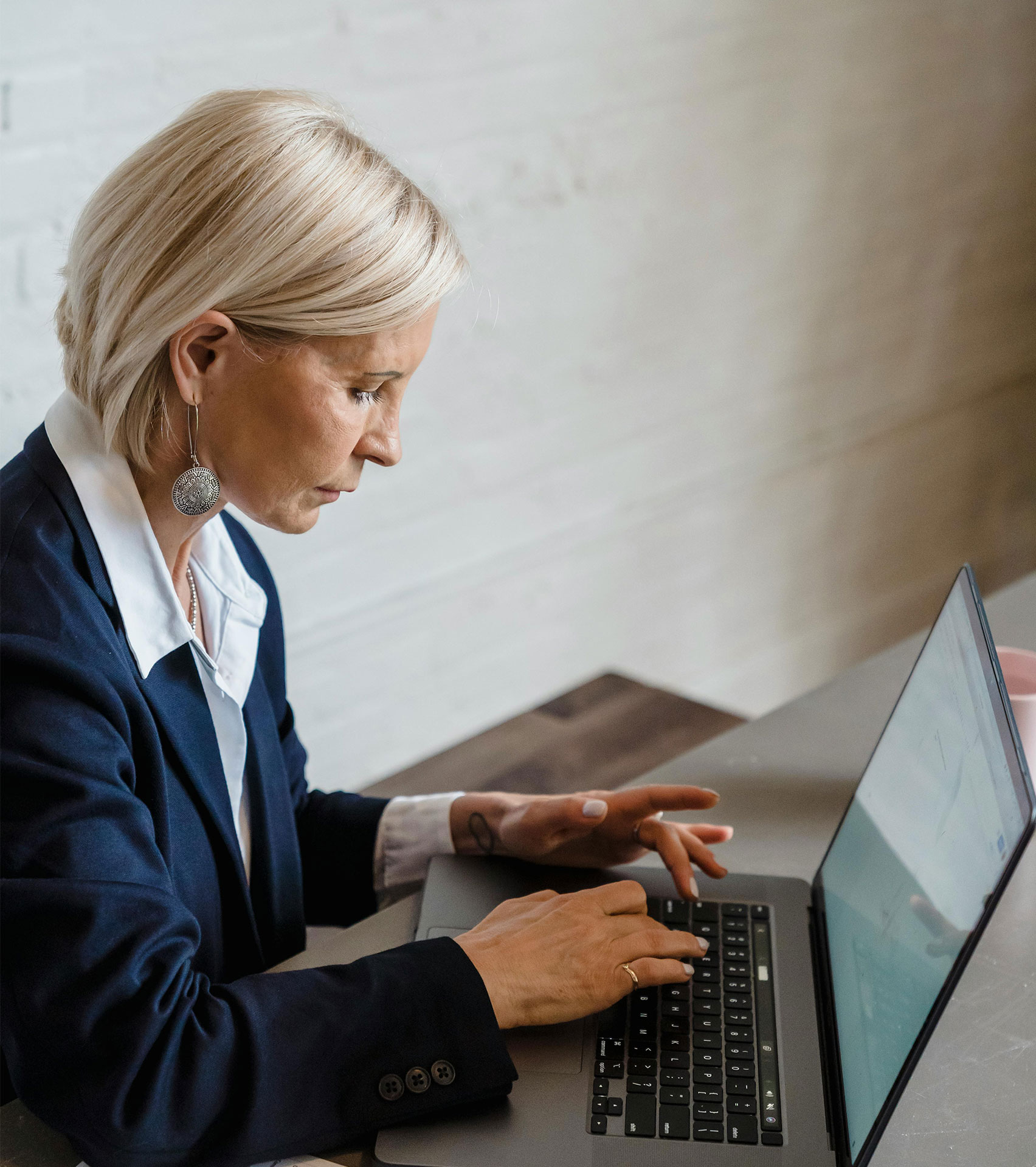 Professional woman working at laptop
