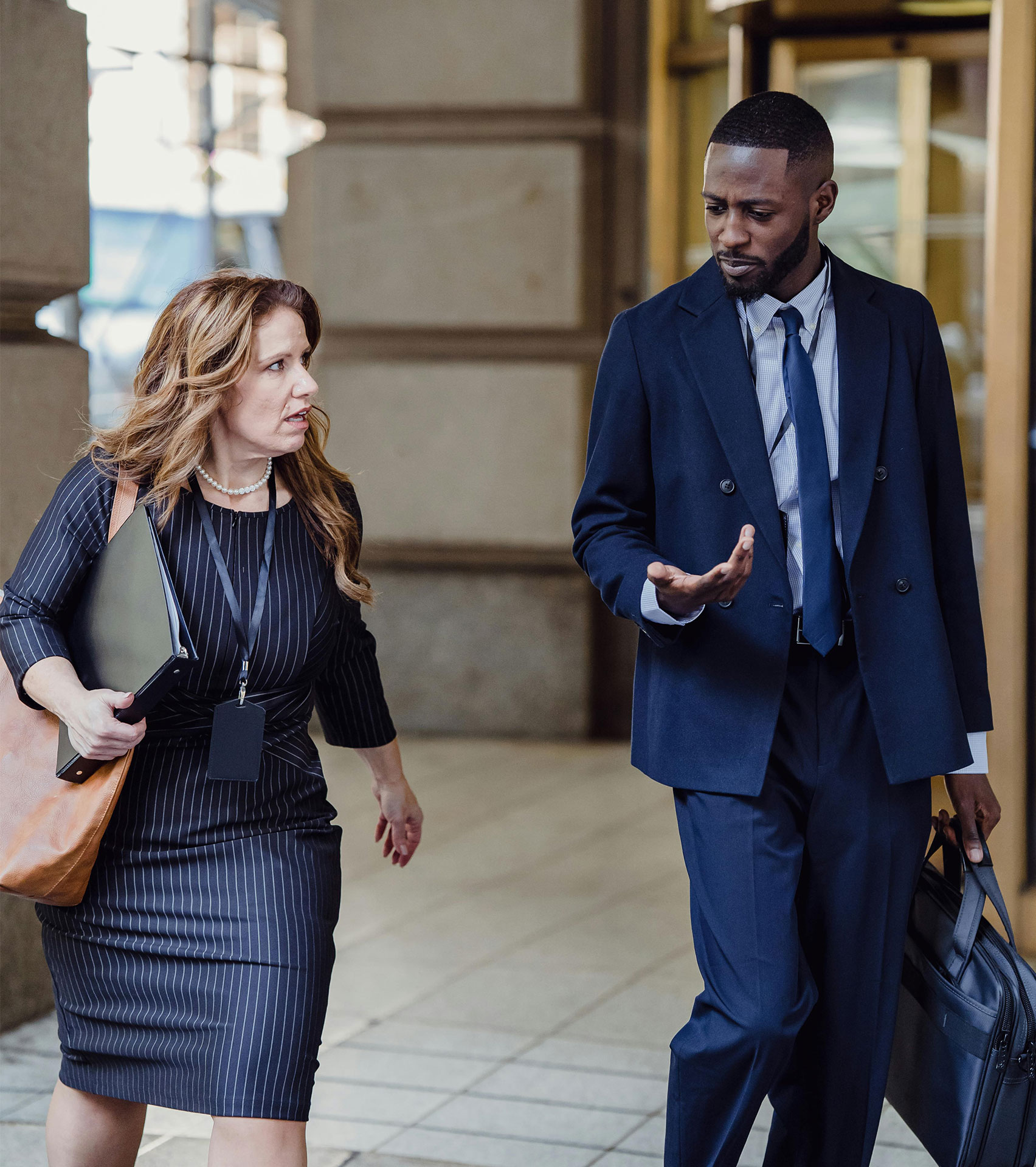 Business professionals walking outside of an office