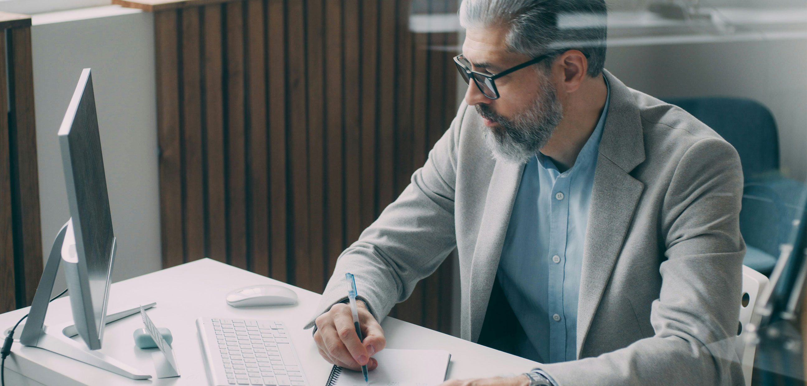 Man at computer at desk in an office