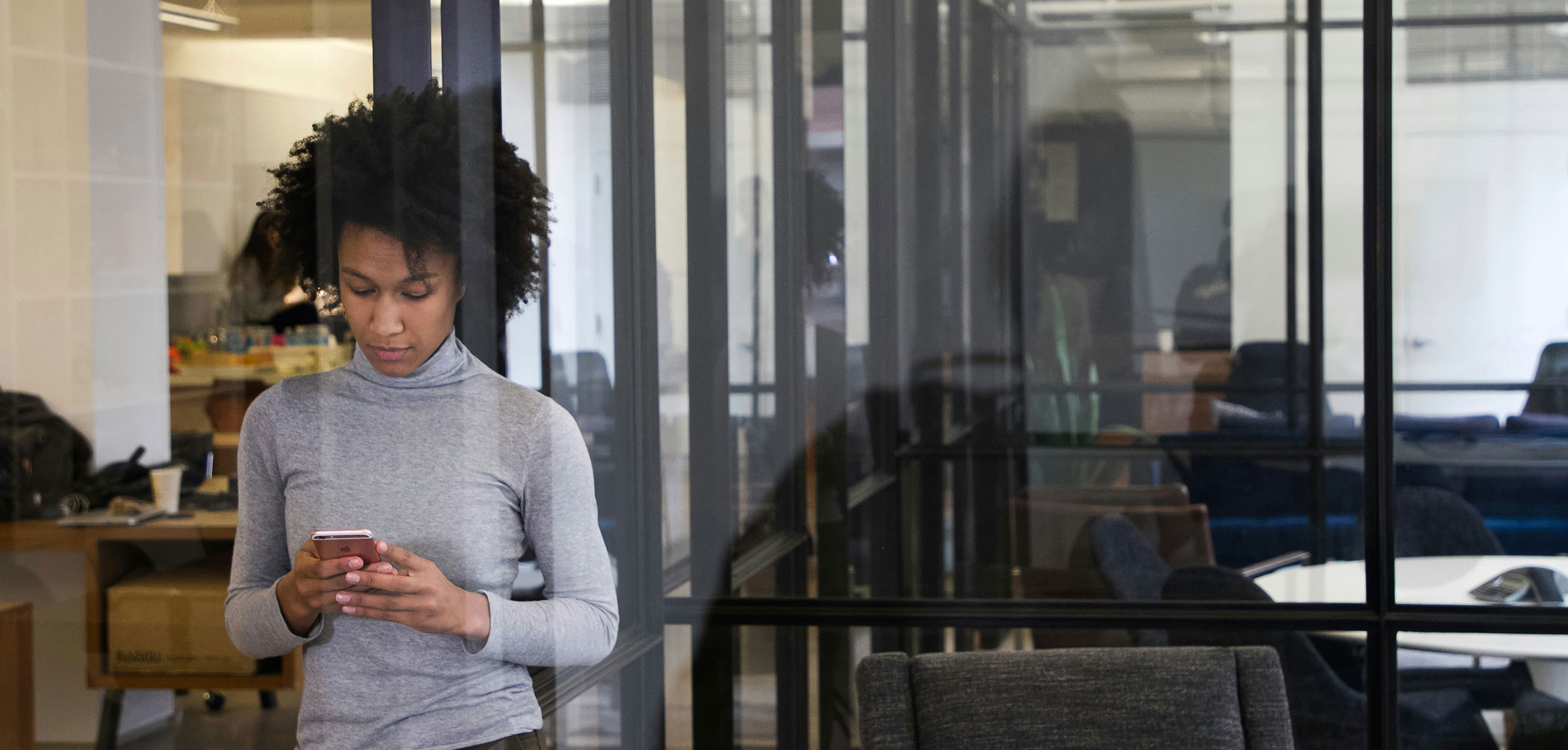 Woman in office on her phone